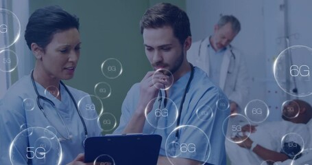 Medical professionals discussing patient data with 6G technology animation overlay - Powered by Adobe