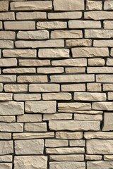 Obraz premium Sandstone Wall Texture Background with Natural Stone Bricks Construction