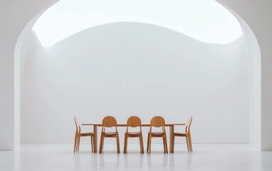 Wooden dining table and chairs in white minimalist dining room with arched doorways and bright natural light