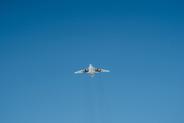 A magnificent plane soars through the vibrant blue sky, showcasing the marvels of fixedwing aircraft and advanced aviation technology, captivating all who watch in amazement