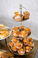 multi tier platter of fresh baked muffins at brunch event