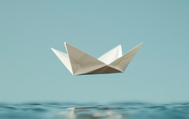 White Origami Paper Boat Floating Above Calm Blue Water