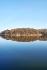 Panoramic symmetrical view of Lake Barlinek, West Pomeranian Voivodeship, Poland.