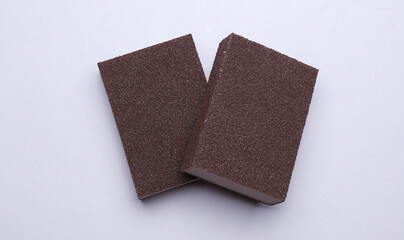 Kitchen sponges on a gray background