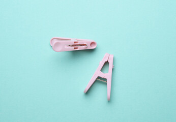 Plastic clothespins on a blue background