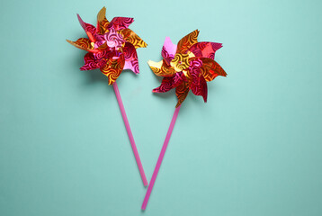 Children's windmills on a stick, blue background