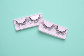 False eyelashes on blue background. Beauty concept