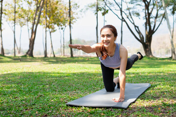 Woman doing core stability pose, front view