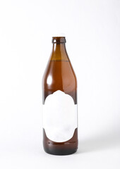Beer bottle with blank white label on white background. Mockup for design