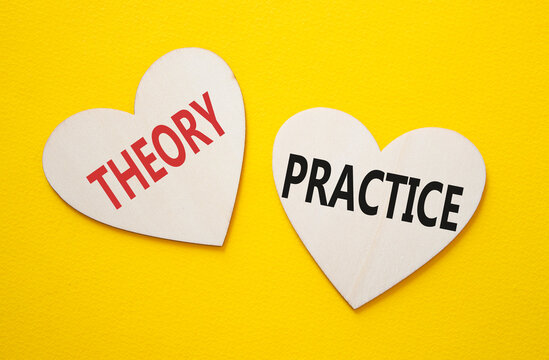 Theory or Practice symbol. Concept word Theory or Practice on wooden hearts. Beautiful yellow background. Business and Theory or Practice concept. Copy space