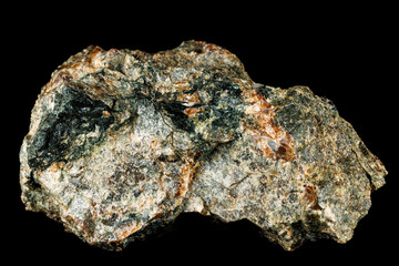 Ferropargasite mineral with rough texture, dark green inclusions, and earthy tones.