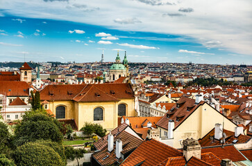 Fototapeta premium Amazing Panoramic View Of An Old Town In Prague Features Tiled Roofs Under A Blue Sky