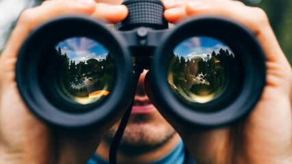 Exploring nature through binoculars in a scenic forest setting