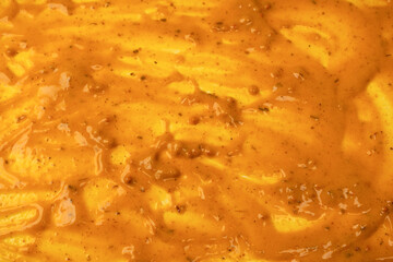 Yellow sauce splashes as a background.