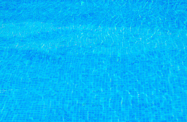 Clear water surface, ripple water in tiled swimming pool