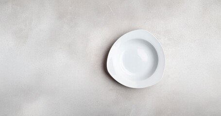 White plate on a light background, top view.