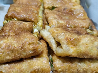 Martabak, Egg Martabak or Egg Martabak. Savory fried pastries filled with eggs, meat and spices. Martabak Telur is a typical Indonesian street snack.