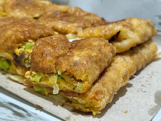Martabak, Egg Martabak or Egg Martabak. Savory fried pastries filled with eggs, meat and spices. Martabak Telur is a typical Indonesian street snack.