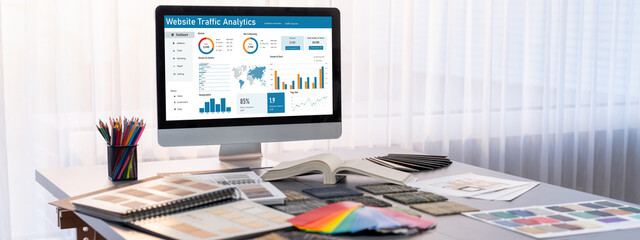 Fototapeta premium Interior designer workspace table and architecture software on laptop screen with mood board materials and colorful swatch color for color selection. Modern interior design office. Insight