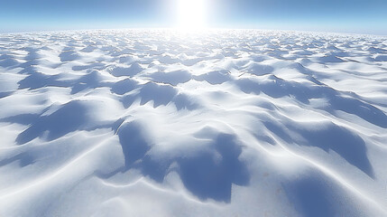 Obraz premium Vast, sunlit snowscape. Undulating drifts create a serene, minimalist winter scene. Perfect for concepts of peace, purity, or climate change. Ideal for websites, calendars, or travel brochures.