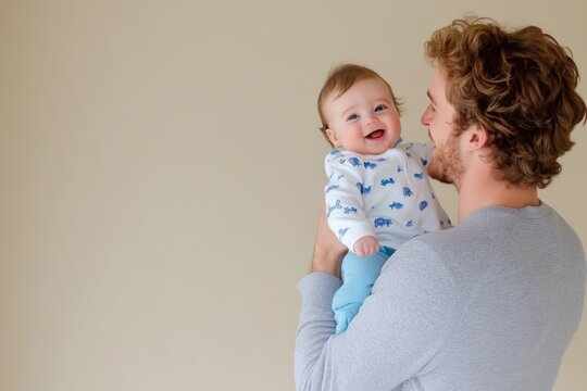 Young father joyfully lifts his newborn in a warm home setting filled with bright natural light, capturing a moment of love and laughter