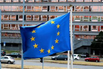 European Union flag of the is blue with yellow stars. The EU flag is waved in the Czech Republic