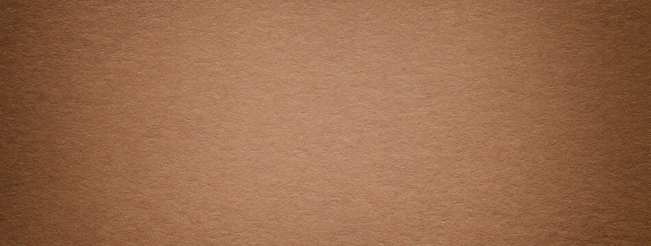 Texture of brown vintage paper gradient background with dark vignette. Structure of craft umber cardboard
