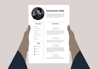 Hands holding a CV that creatively outlines education, experience, and skills, highlighting modern design and personal branding in career advancement