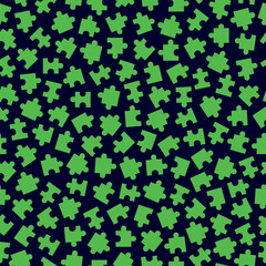 Seamless decorative dark blue background with green puzzles.