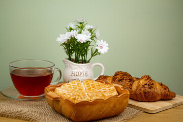 Waffle, croissants and tea.Tea drinking.Fresh homemade pastries. Waffle close-up