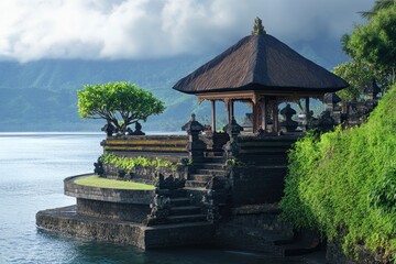 Obraz premium Visiting Traditional Balinese Temple on the Lake with Cloudy Mountain Backdrop