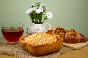 Homemade pastries. Sweet pastries at home. Croissants, waffles on the table