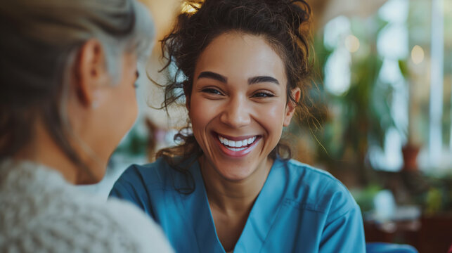 A home health care worker assists an elderly woman in her home / Healthcare aide / Medical assistant
