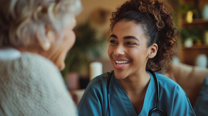 A home health care worker assists an elderly woman in her home / Healthcare aide / Medical assistant