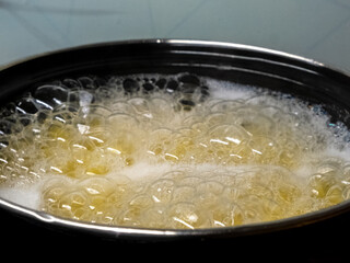 A Pot Filled with Bubbling Liquid, Releasing an Inviting Aroma and Gentle Heat That Entices