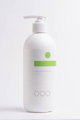 White plastic bottle with dispenser on white background. Isolated.