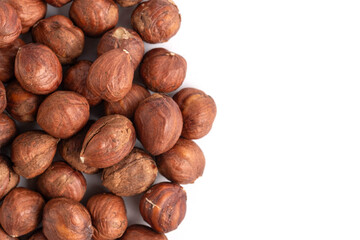 Heap of hazelnuts on white background. Top view.