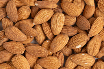 Closeup of almond nuts as background. Whole background. Top view.