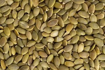 Pumpkin seeds background. Closeup. Top view.