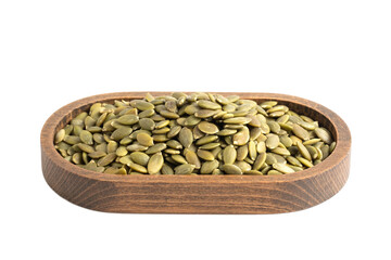 Pumpkin seeds in wooden bowl isolated on white background. Clipping Path.