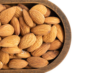 Almond nuts in wooden bowl isolated on white background.