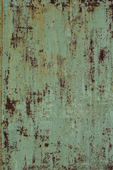 Background with rusty metal texture painted with green paint.