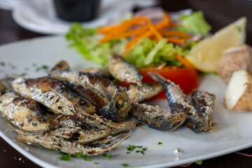 Fried sardines with salad in restaurant Canary islands Spain