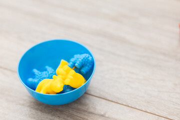 Yellow and blue toys for a child. How Ukrainian children play. Children during the war in Ukraine. Children's sorter. Early child development. Development of children's fine motor skills and logic.