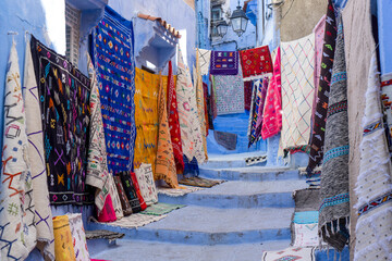 Chefchaouen Blue Street with Traditional Carpets for Sale

