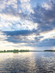 Cloudy sky with a lake in the background