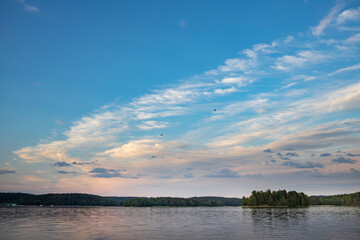 A beautiful lake with a clear blue sky above it