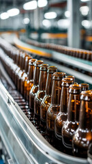 Bottles moving along a conveyor belt in a brewery during the production process in early morning light
