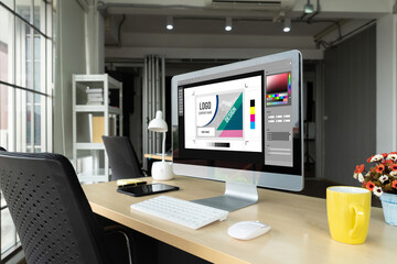 Graphic designer software for modern design of web page and commercial ads showing on the computer screen