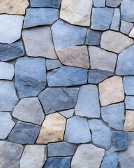 Stone wall texture with various shades of blue and beige
